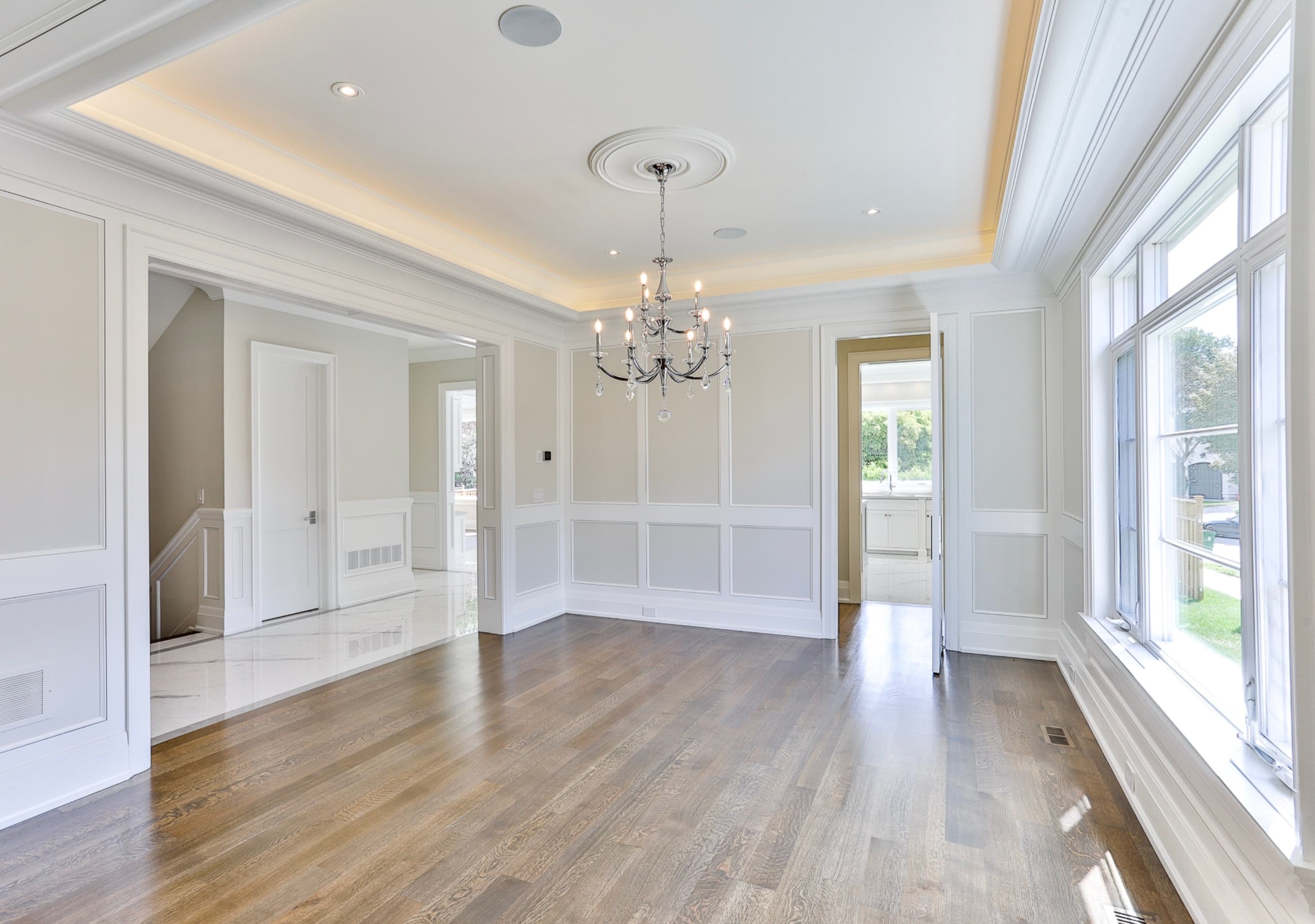 Full-height wall panelling and tray ceiling with cove lighting, Uniline project